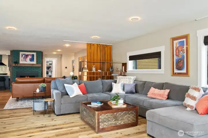 Living room has spaces for large or intimate gatherings