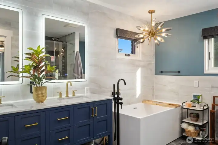 Primary ensuite with soaking tub and double vanity