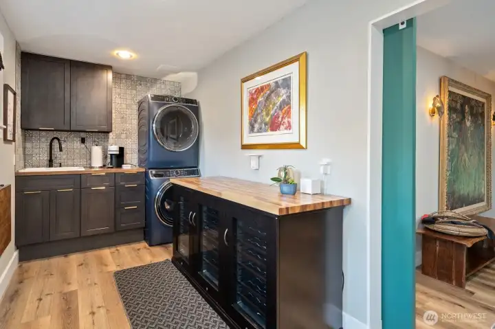 Laundry room with utility sink and wine cooler