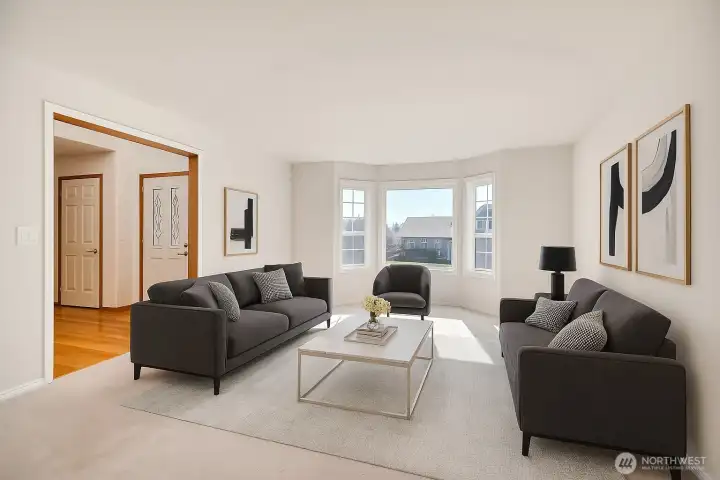 Living room with tons of natural lighting. virtually staged