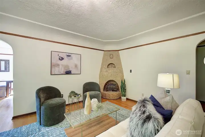 Quaint electric light fireplace for ambiance.