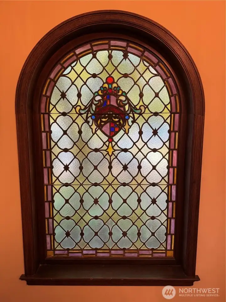 Leaded/stained glass window in entry of complex.