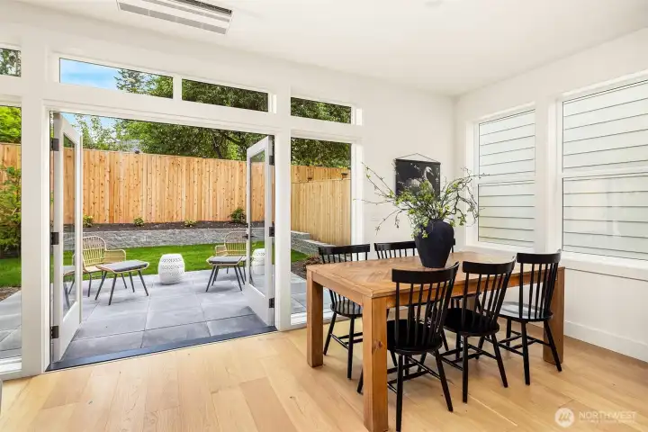 Ample dining space and French doors leading out to patio and private yard