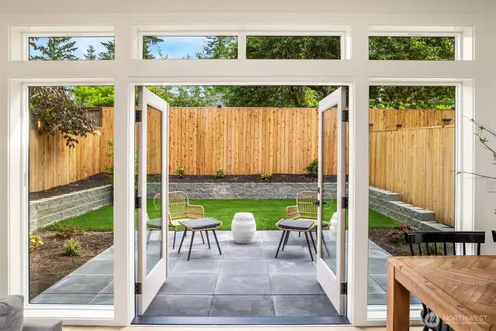 French doors leading out to patio and private yard