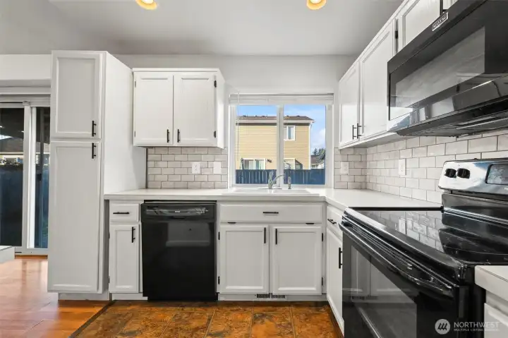 Kitchen with window looking out in backyard
