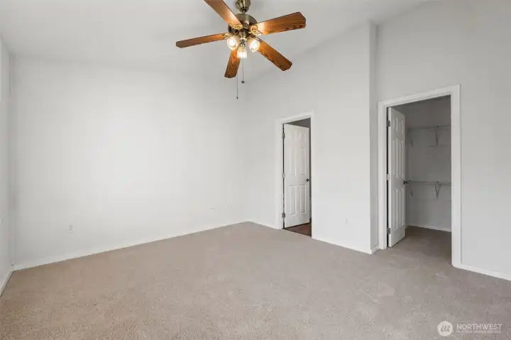 Primary En-Suite looking at full bathroom and walk-in closet. Brand new carpet and fresh paint