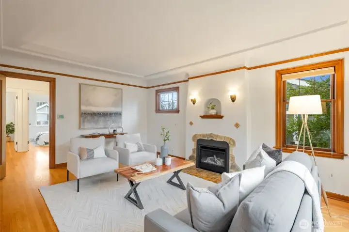 Original wood wrapped windows, stucco fireplace & original tile detailing