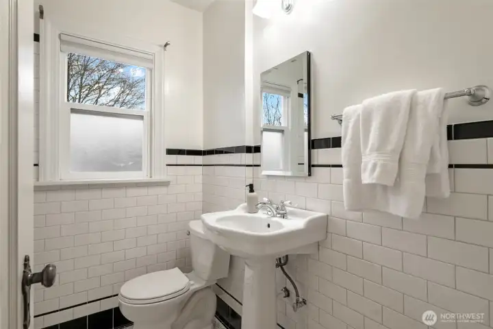 Updated hall bathroom with periodic detailing