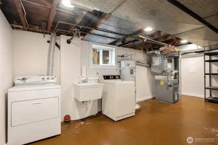 Large laundry room with extra storage + room to add another bathroom