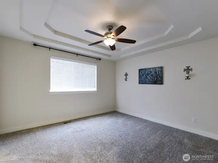 Primary bedroom. Coffered Ceiling/ Fan/light.