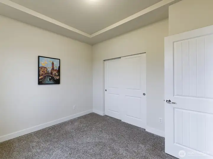Large closet with shelving front bedroom.