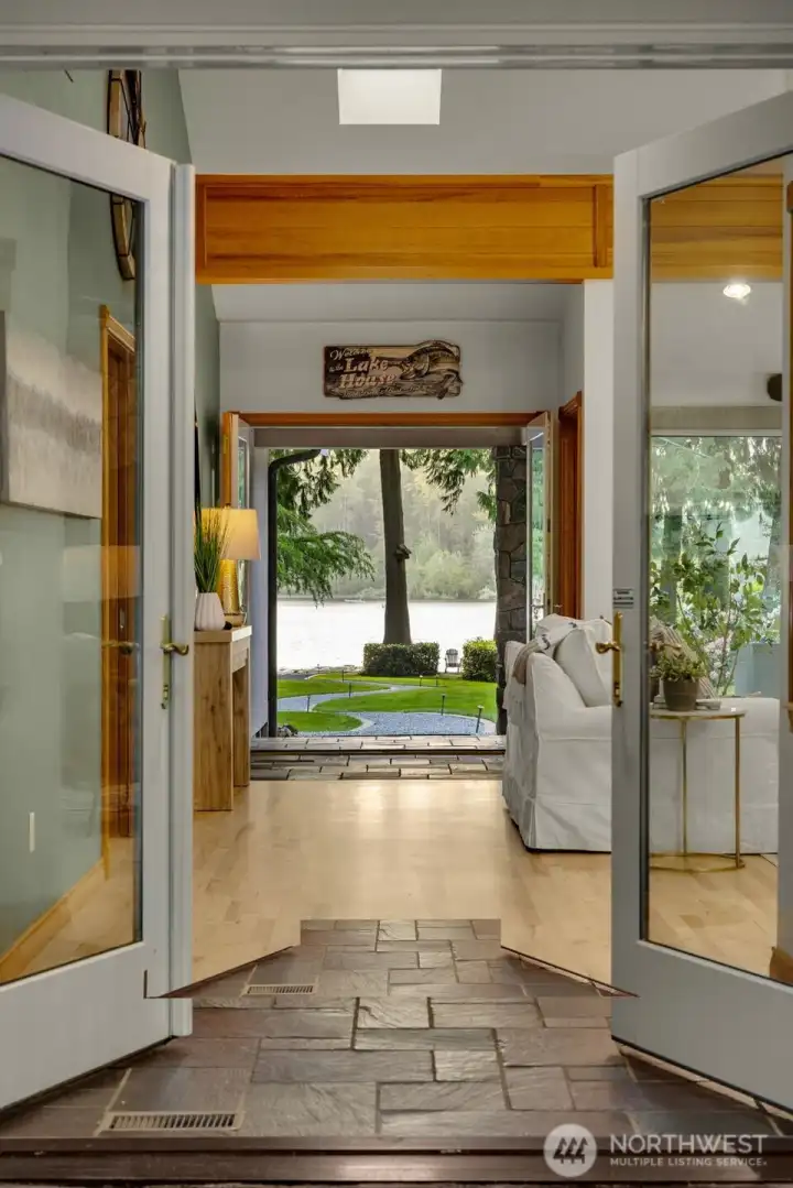 Custom windows & doors frame tranquil views of the lake and surrounding grounds Custom windows & doors frame tranquil views of the lake and surrounding grounds