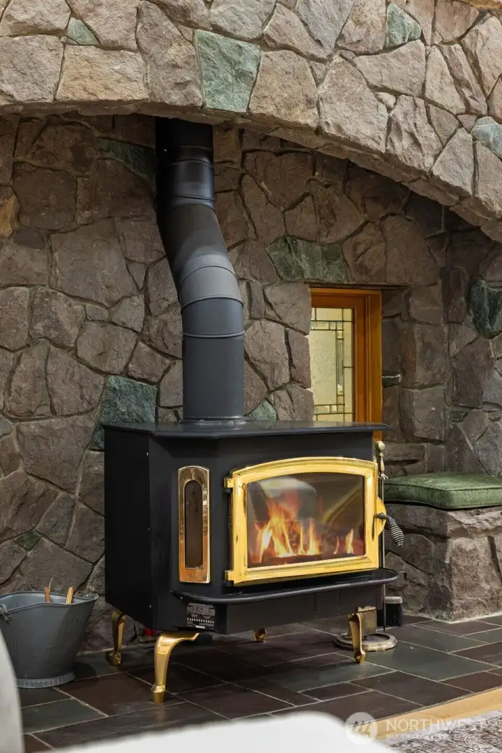 Wood-burning stove and striking rock wall Wood-burning stove and striking rock wall