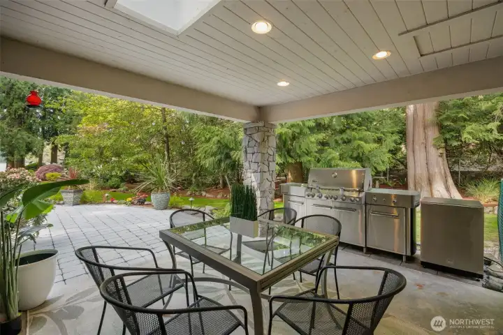 Covered outdoor entertaining area with gas fireplace and TV Covered outdoor entertaining area with gas fireplace and TV