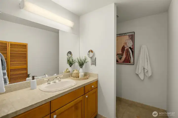 Separate his-and-hers bathrooms in the primary bath Separate his-and-hers bathrooms in the primary bath