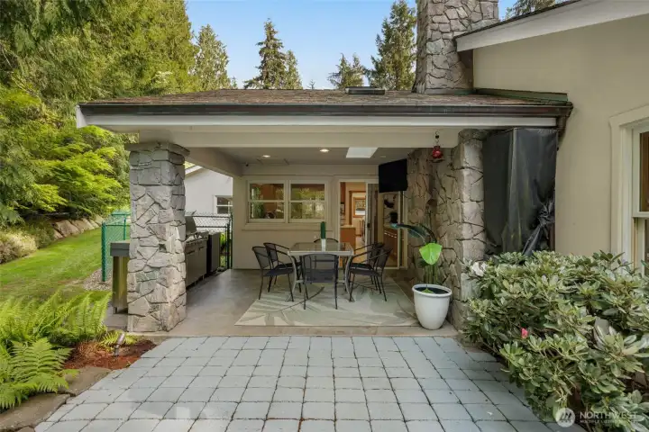 Covered outdoor entertaining area with gas fireplace and TV Covered outdoor entertaining area with gas fireplace and TV