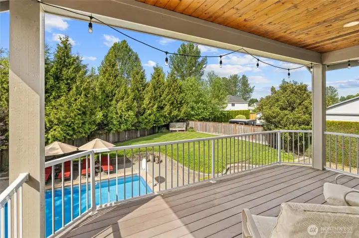 Covered Large deck overlooking back yard from Primary Bedroom suite. Covered Large deck overlooking back yard from Primary Bedroom suite.