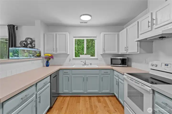 SS Dishwasher, Microwave and Fridge. The only appliance yet to be upgraded is the glass flat top white range which is working perfectly and the owners didn't need to update it for their needs.
