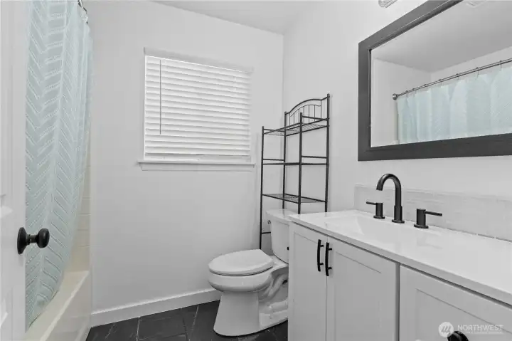 2nd Full Bath w/Custom Tile Floors and New Vanity, Counter and Custom Tile Backsplash. New toilet, mirror and fixtures too!