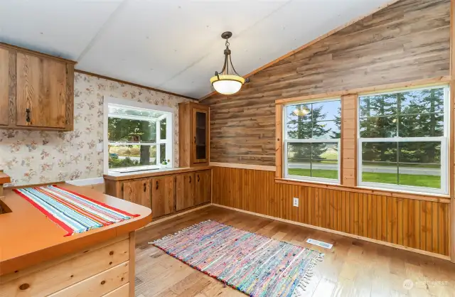 Wood walls off dining area-with built in storage