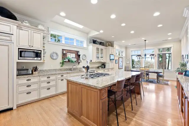 This light and bright kitchen has tons of storage and a lovely dining area overlooking the manicured yard and Lake Steilacoom.