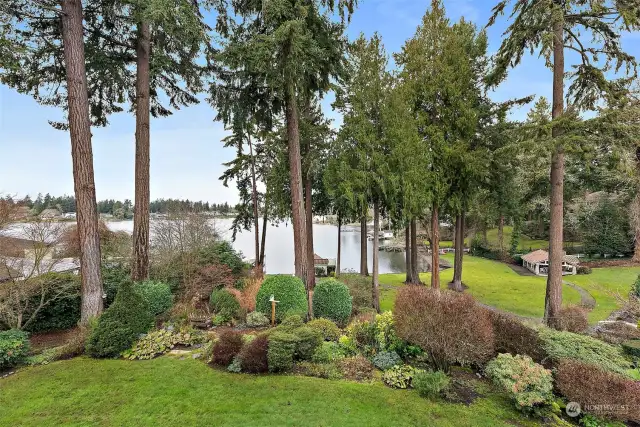 The structure to the right is a community gazebo, compete with bathroom and wood burnin fireplace.   Each home has a storage closet in the boathouse that is adjacent to the dock. (visible on the left)