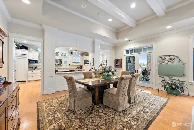 French doors open onto a deck that is large enough to accommodate a table and chairs and has a wood-burning fireplace. This outdoor space is a great place to enjoy a meal or entertain guests.