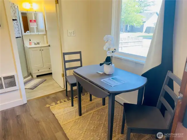 Dining area looking into bathroom