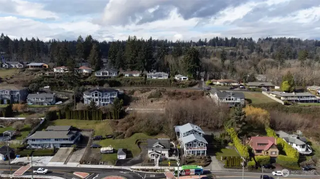 Drone shot looking west to building lot before construction.