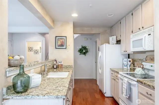 Kitchen with granite countertops & hardwood floors!