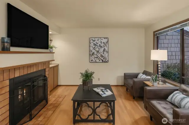 The family room off of the kitchen is another great spot to relax, enjoy a fire, or watch TV and converse with the cook.