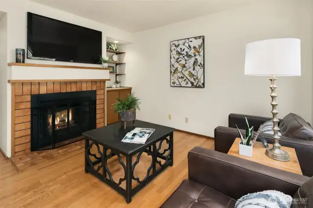 A cozy fireplace and dry bar in the family room.