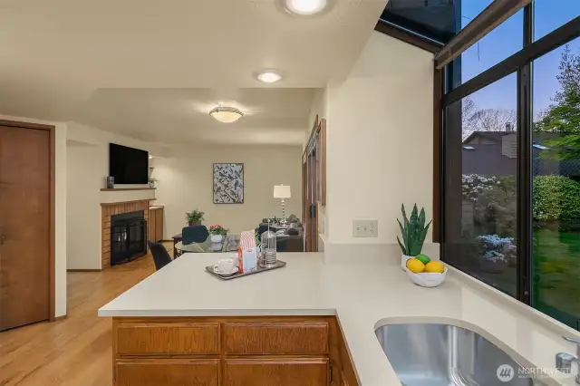 Check out the pantry space shown to the left and the wood burning fireplace beyond.