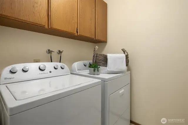 Full-size laundry room on the main level with plenty of storage.