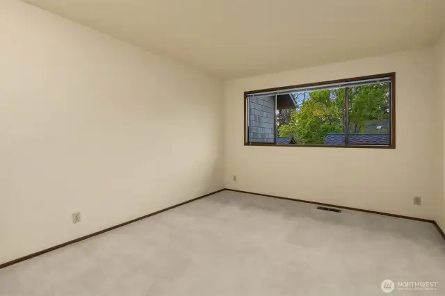 Bedroom 2 upstairs is spacious and will easily accommodate large furniture and bedding.