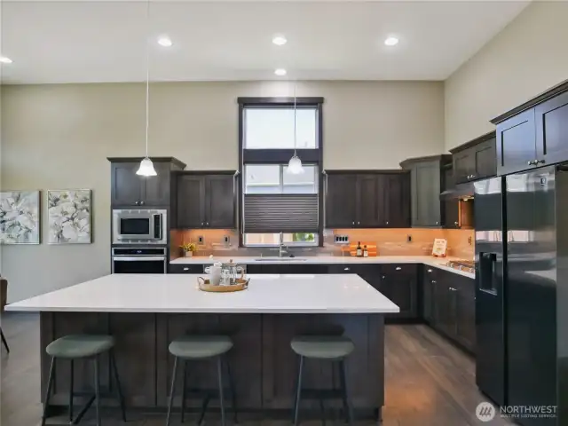 Large window in the kitchen adds light while fully adjustable blinds allow privacy.