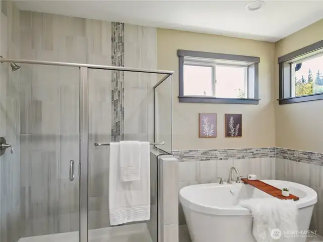 Walk-in shower with tile finish.