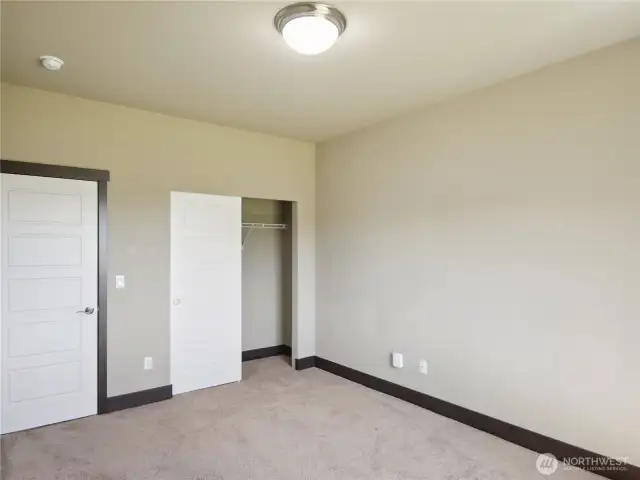 One of two secondary bedrooms.