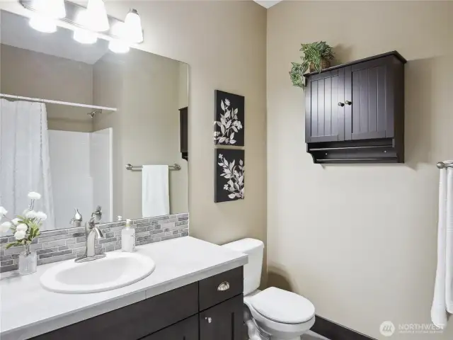 Full bath with tub and shower.