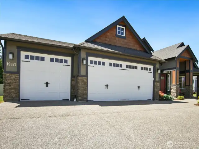 Three car garage, Driveway upgraded with decorative stone finish.