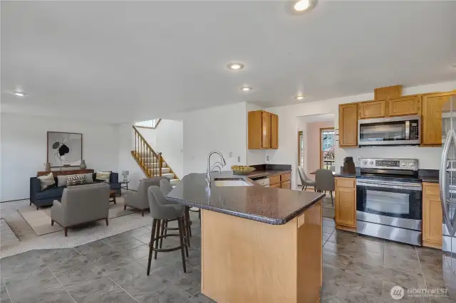 They say the kitchen is the heart of the home! This opens to the family room and is very bright too!