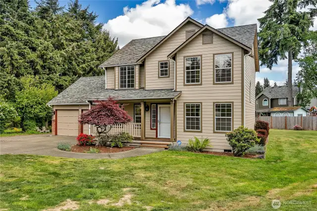 As you approach the home, there is a covered porch that greets you.