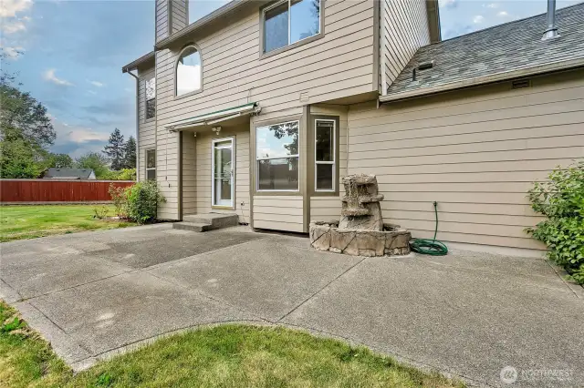 Off the family room and nook area is a large, low-maintenance patio with a retractable covered awning and soothing fountain. What a wonderful place to relax!