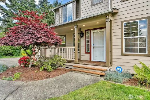 Here's a closer look at the cozy, covered porch.