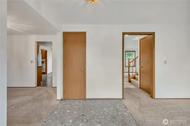 Once you enter, the formal living room is located to the right and the formal dining room is to the left. It's a wonderful circular floor plan. There is a coat closet direcly in front for ease.