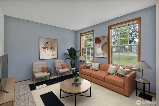 The spacious living room features two attractive picture windows that overlook the front. They let in plenty of light!