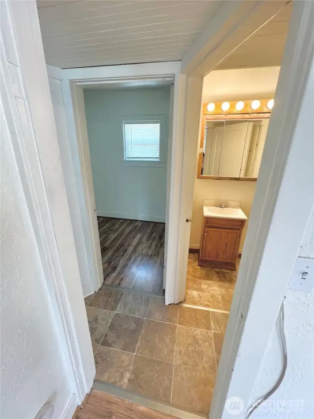 Hallway from living area into Full Bathroom