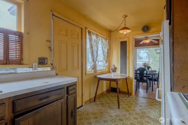 Step out on directly from the kitchen to the back wooden deck for a quick barbeque.