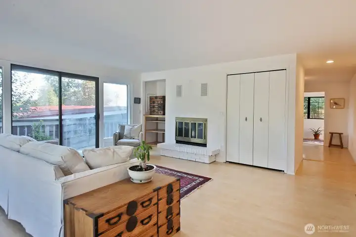 We are entering through the front foor into the living room. Sunroom is to the far right with the kitchen also around the corner.
