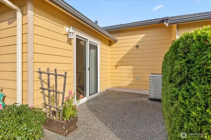 Private patio off primary bedroom.